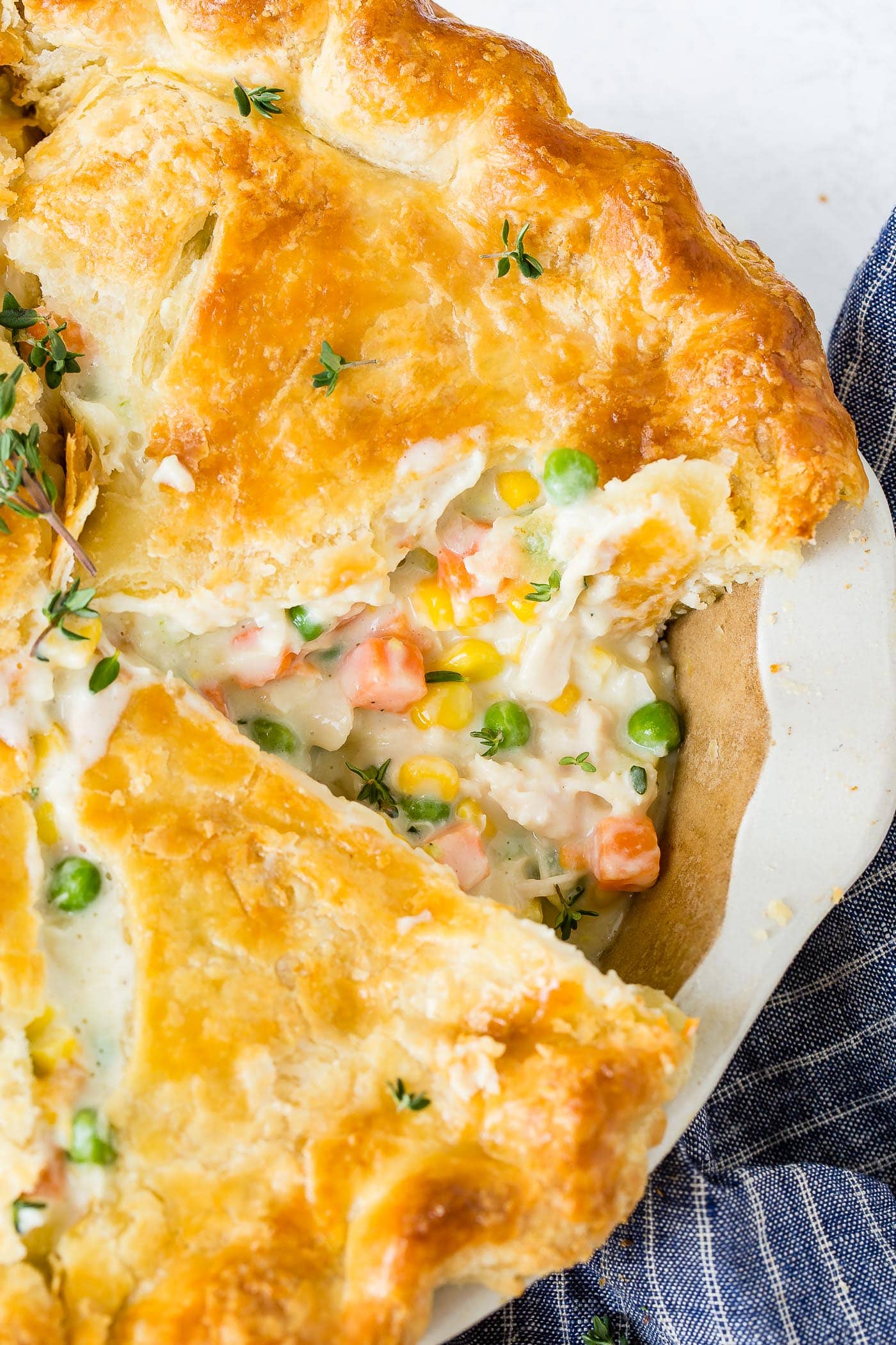 A large chicken pot pie with a pie-like piece taken out of it. Image from Oh Sweet Basil